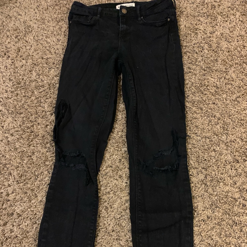 skinny, low waisted black jeans.